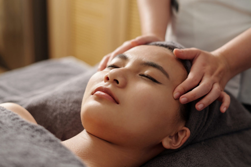 Person receiving a scalp massage at Tula Massage